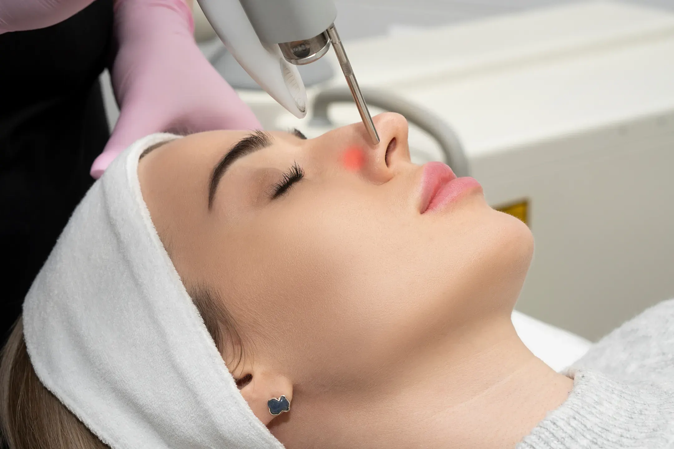 Fotona laser handpiece in use during a treatment